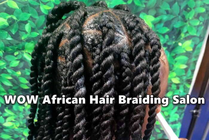 Young girl with triangle parts Senegalese twists at kids hair salon.