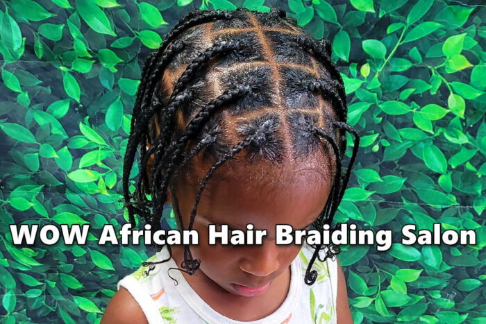 Young boy with two-strand twists ready for back to school at kids hair salon.