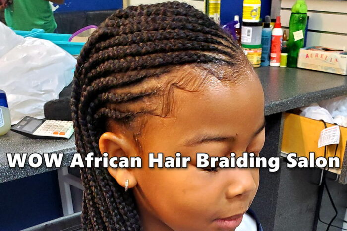 Young girl with two layer cornrows at kids hair salon.